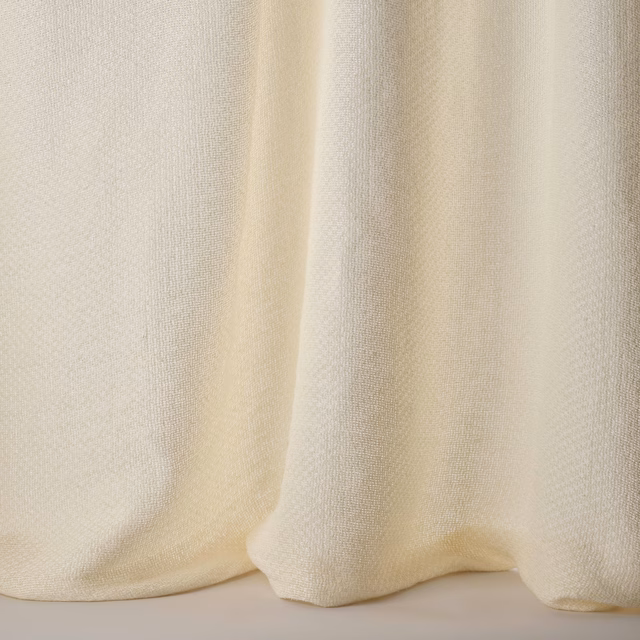 Soft cream plain fabric with fine weave and gentle drape