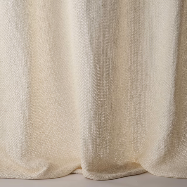 Soft warm ivory plain woven fabric with subtle linen texture and gentle drape