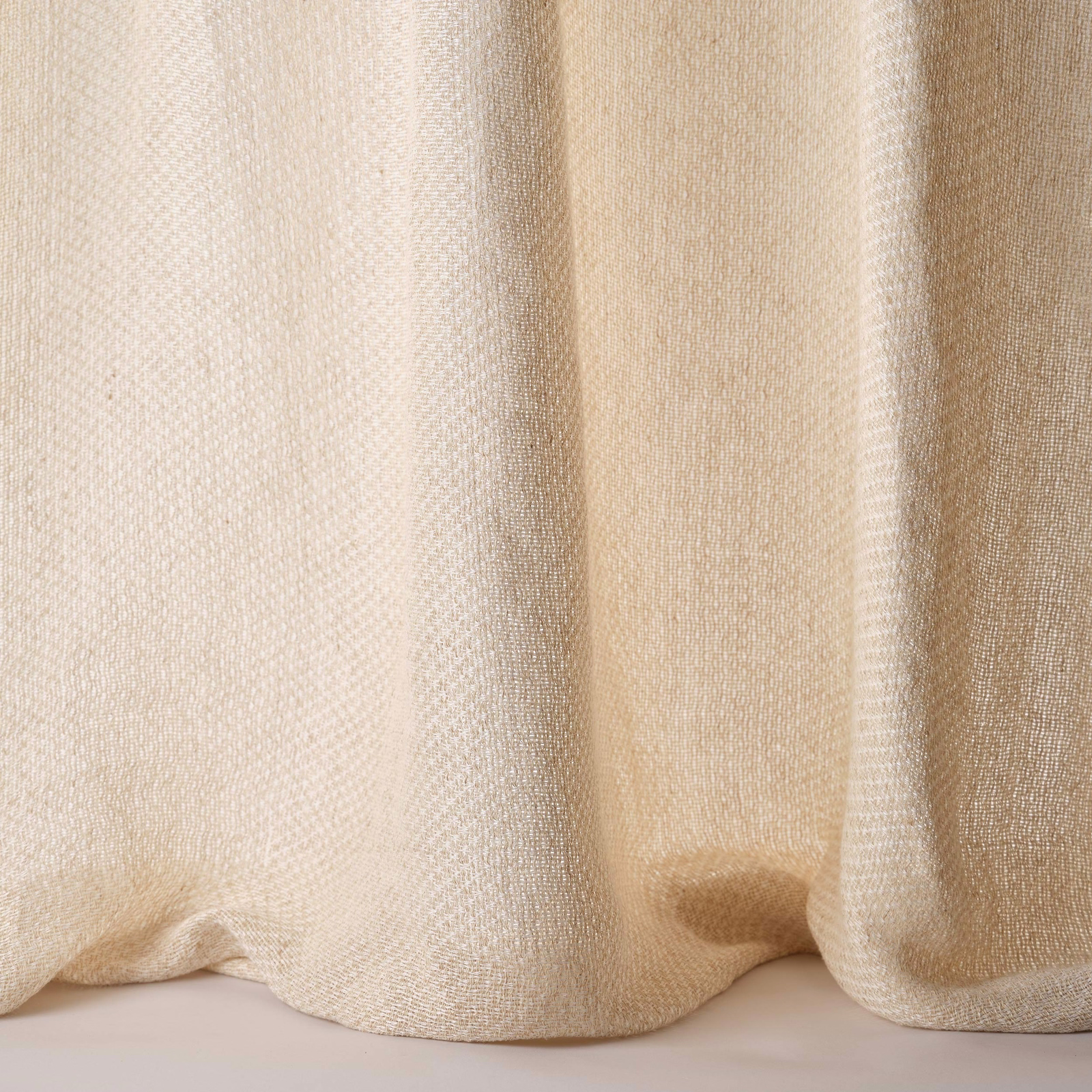 Pale sand beige woven fabric with soft folds and subtle linen-silk texture