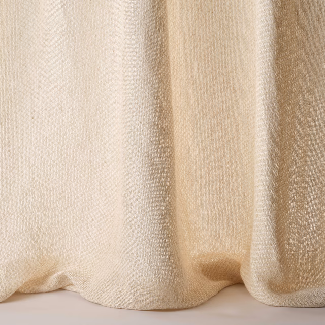 Pale sand beige woven fabric with soft folds and subtle linen-silk texture