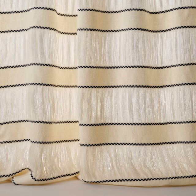 Cream textured fabric with narrow black horizontal stitched stripes