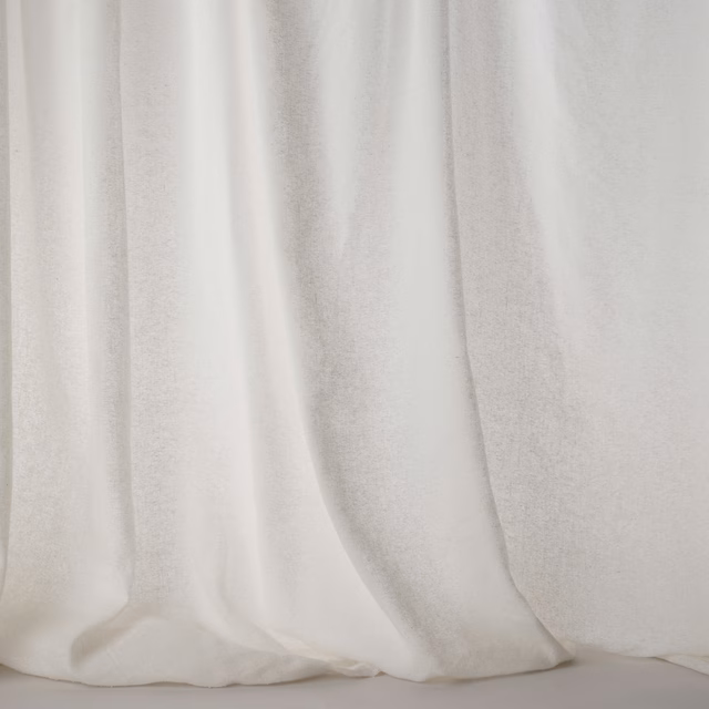 Soft ivory white plain fabric with a gentle silky sheen and subtle linen texture