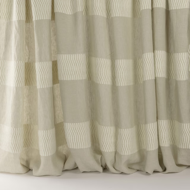 Beige striped curtain fabric with soft woven bands and a relaxed drape