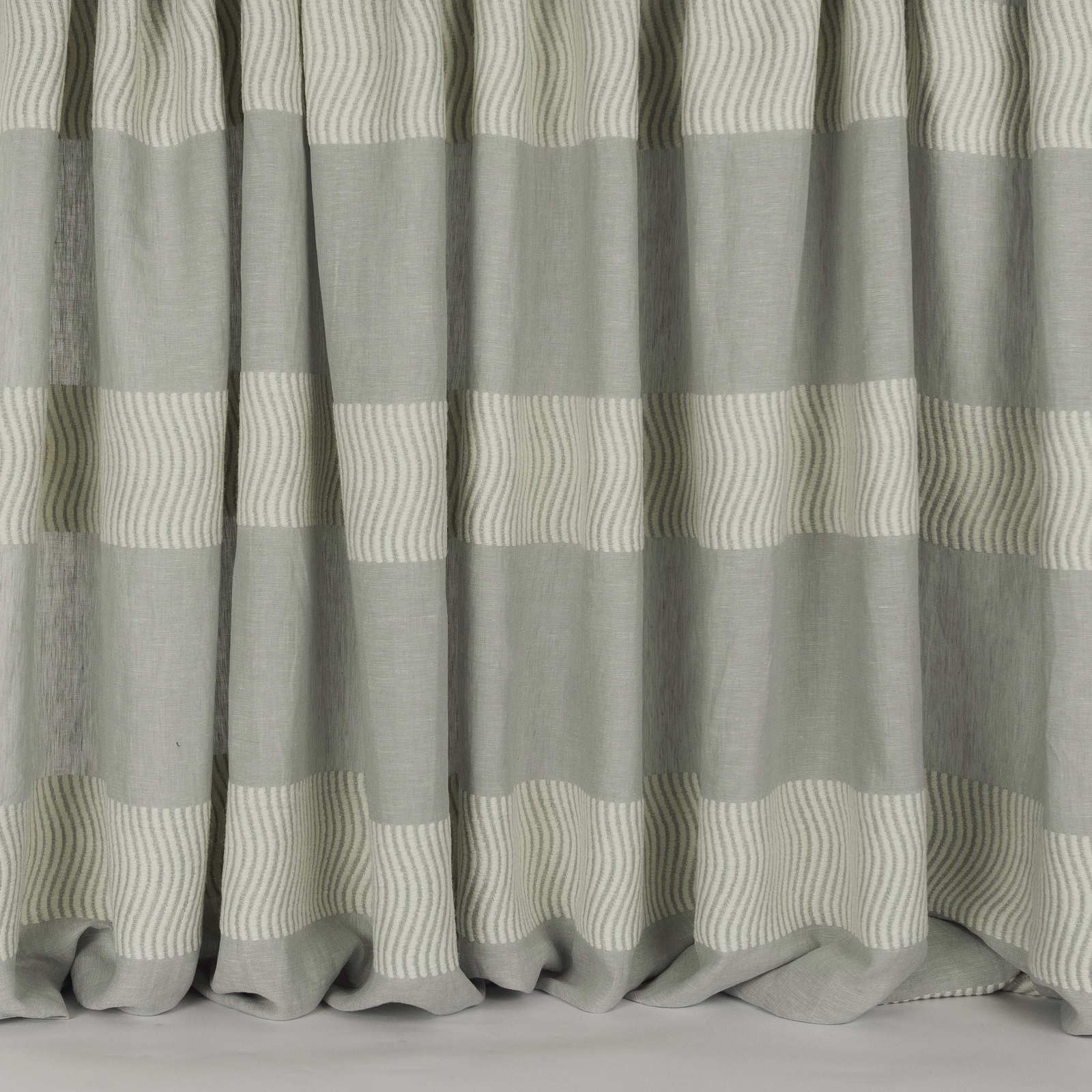 Soft grey striped fabric with wide bands and fine wavy linear detailing