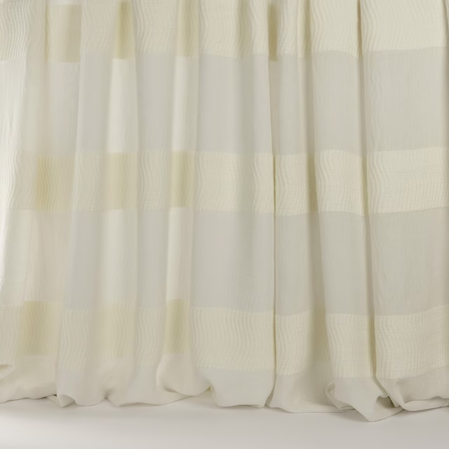 Sheer ivory striped fabric with soft woven bands and a relaxed drape