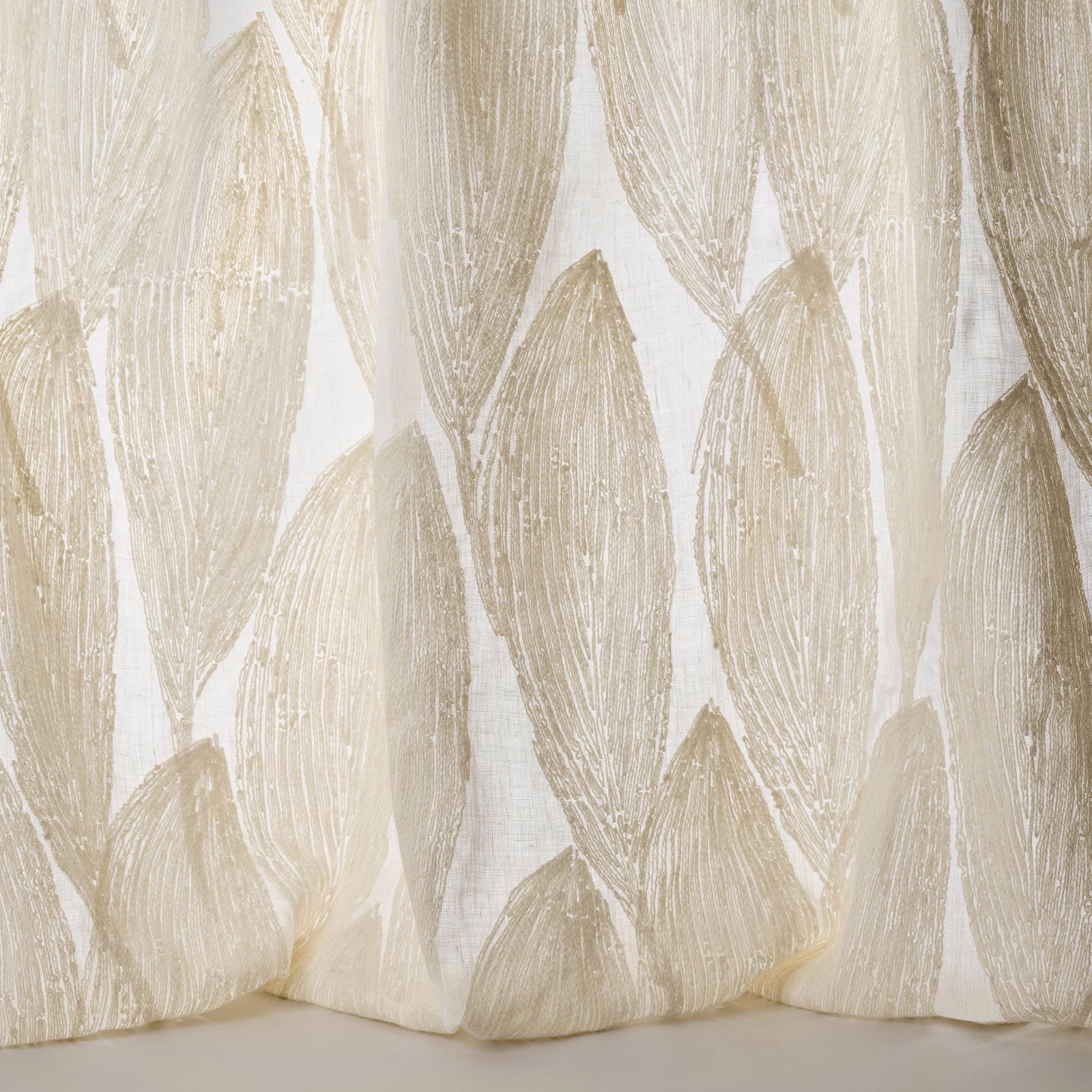 Cream and clay leaf motif fabric with textured woven detailing
