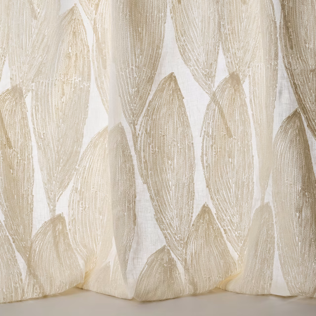 Cream and clay leaf motif fabric with textured woven detailing