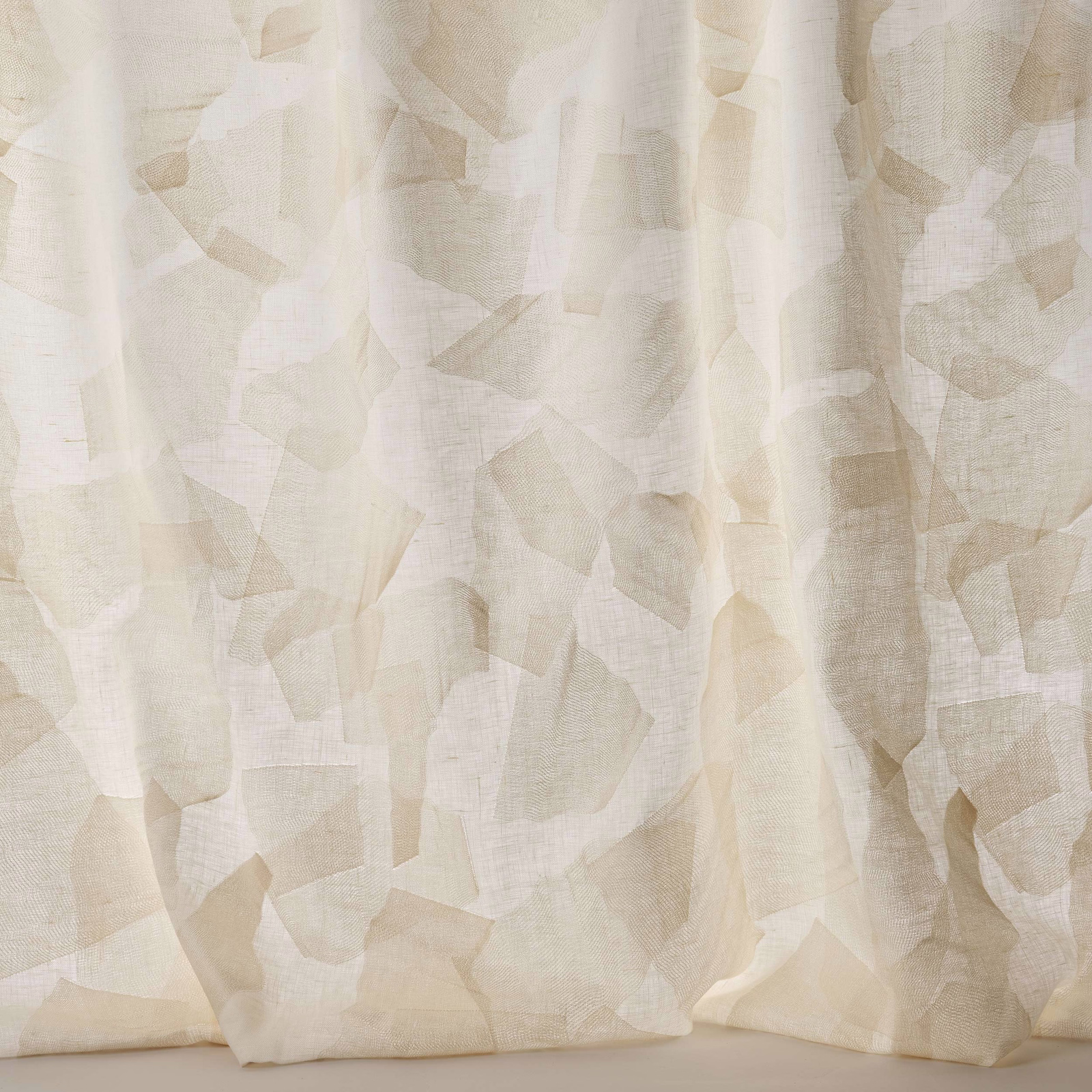 Pale cream Larsen fabric with layered geometric shapes and a soft linen texture