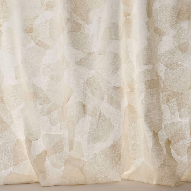 Pale cream Larsen fabric with layered geometric shapes and a soft linen texture