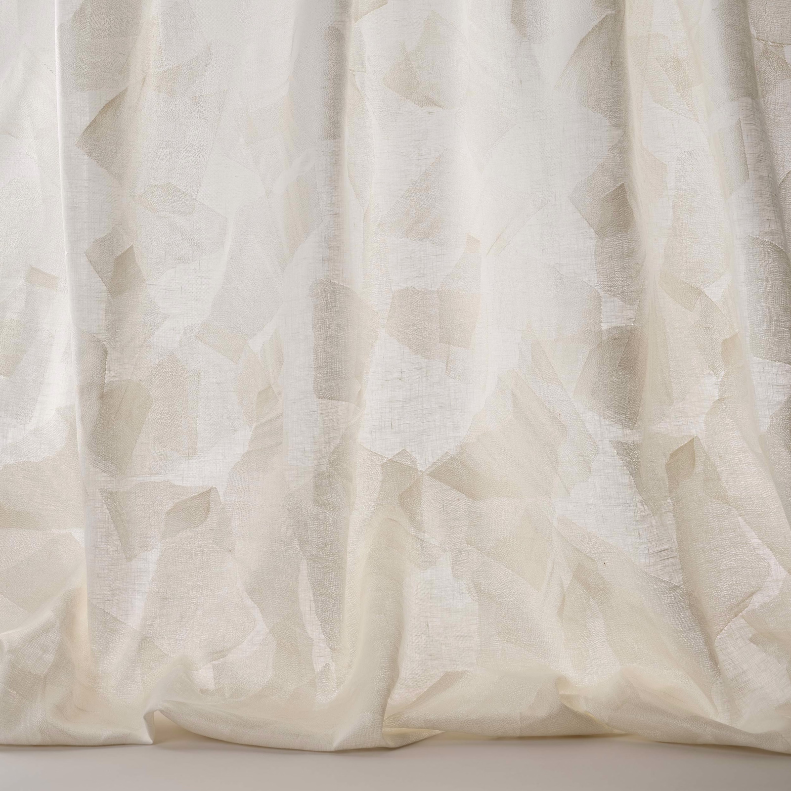 Creamy white geometric fabric with soft tonal pattern and linen texture