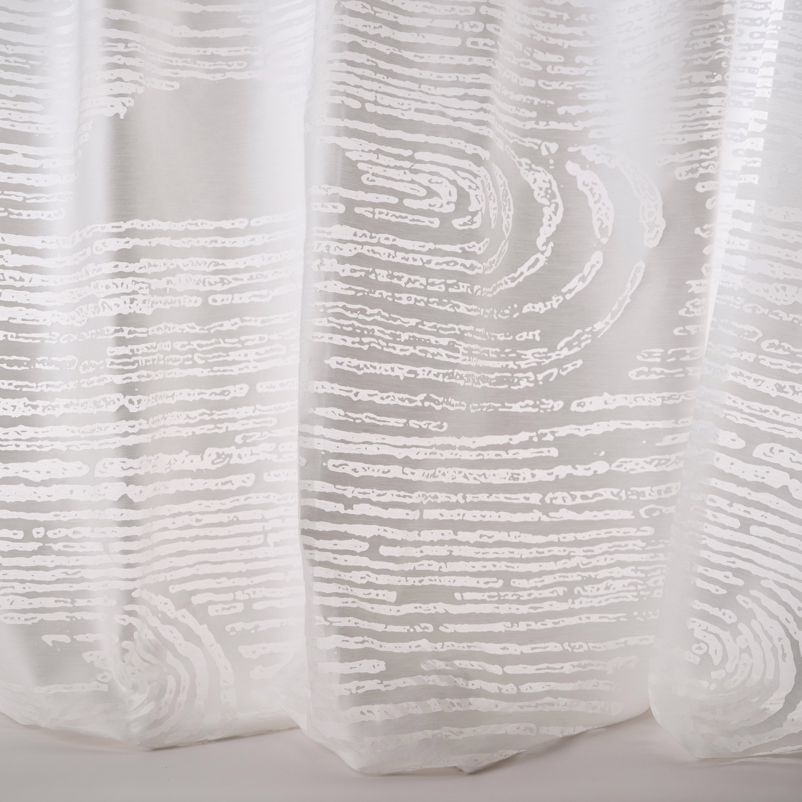 Sheer white fabric with large abstract ripple stripes and soft woven texture