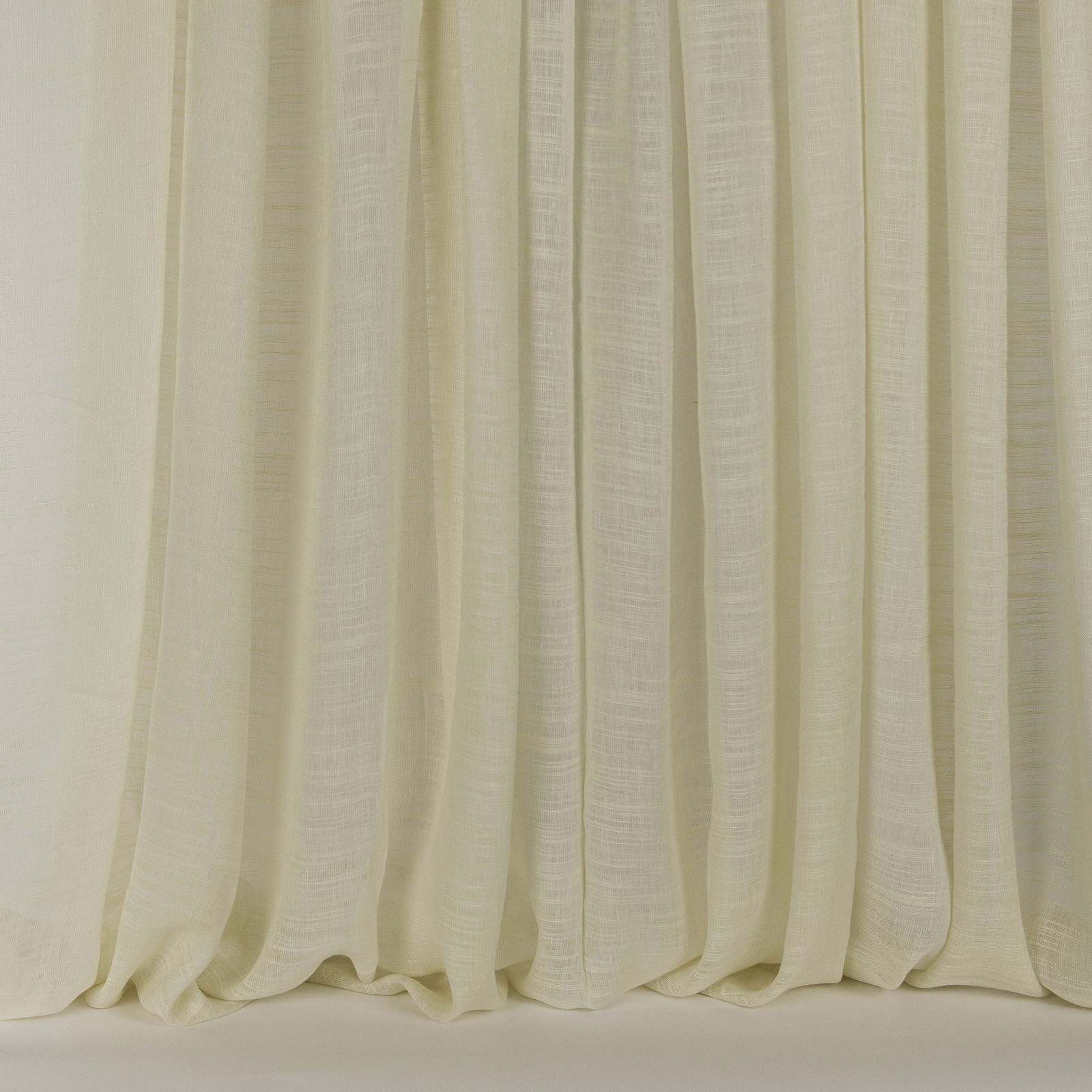 Pale cream linen-silk curtains with a soft slubbed texture and gentle drape