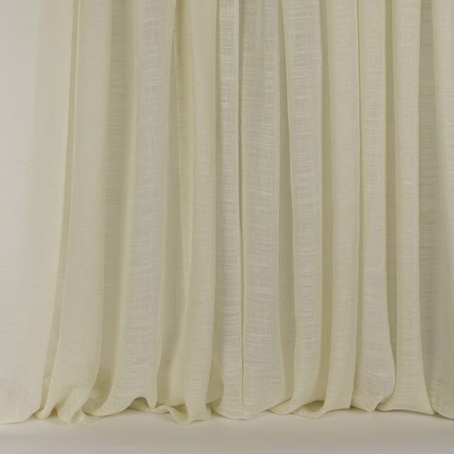 Pale cream linen-silk curtains with a soft slubbed texture and gentle drape