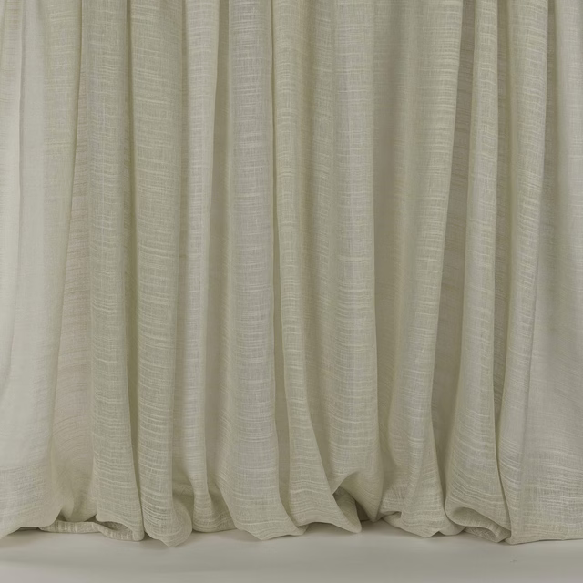 Pale ivory silk-linen curtain fabric with subtle slub texture and soft folds