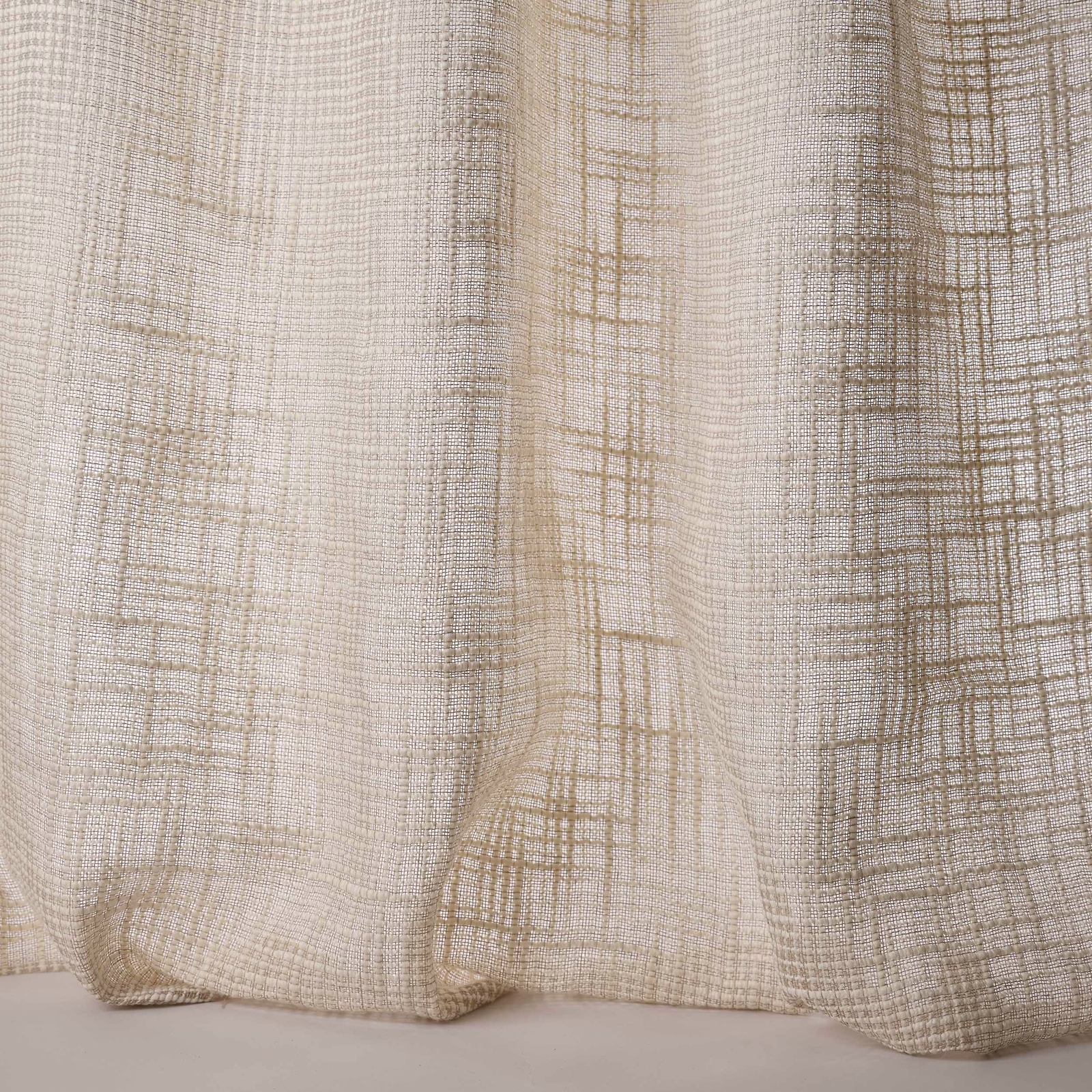 Warm cream woven fabric with subtle beige grid texture and soft folds