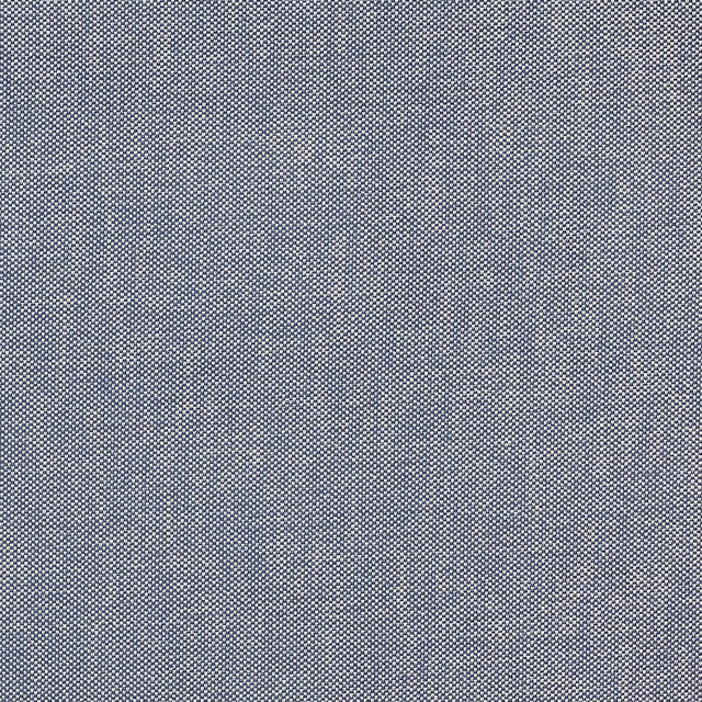 Close-up of a finely woven soft denim blue fabric with a speckled texture