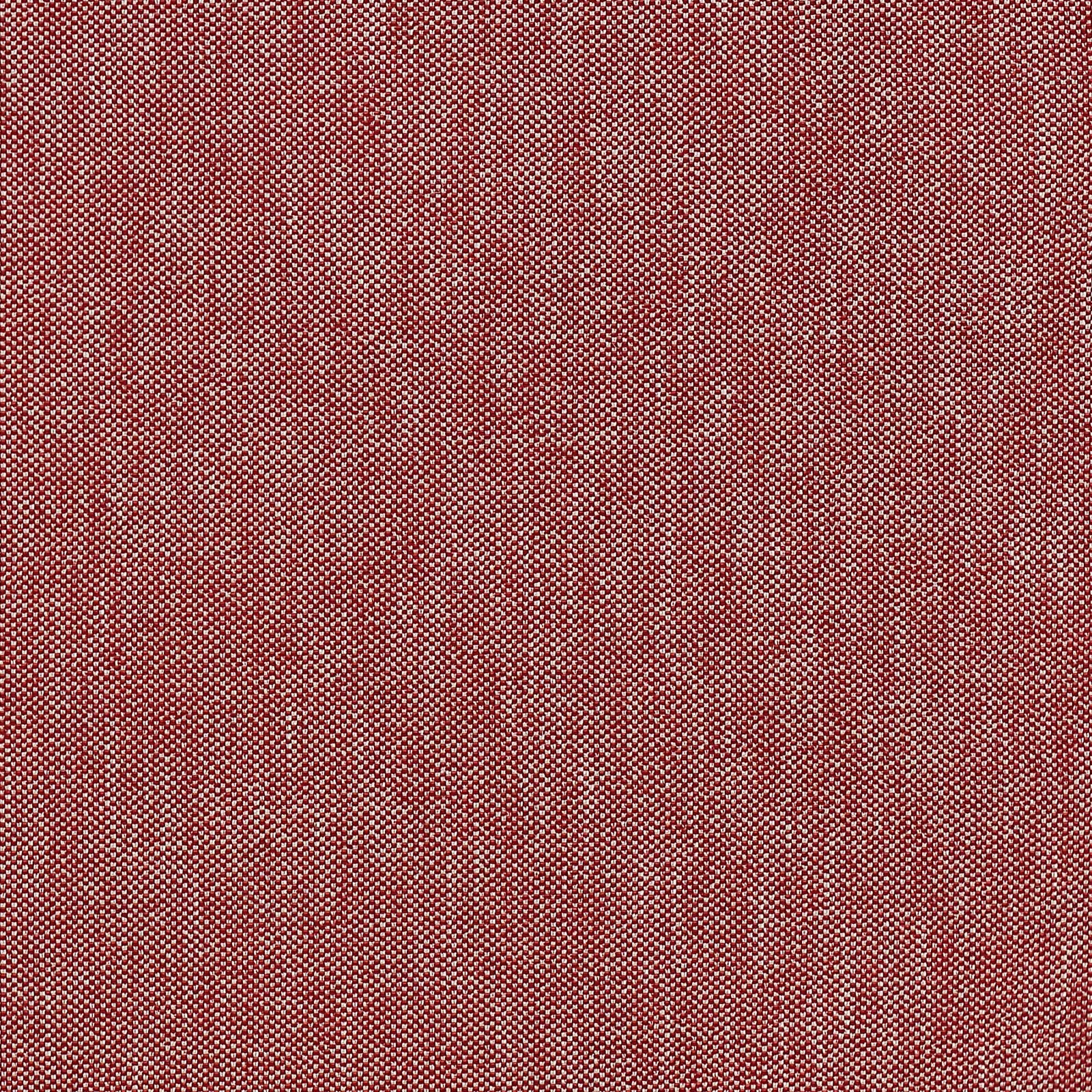 Close-up of a muted red woven fabric with fine peppered texture