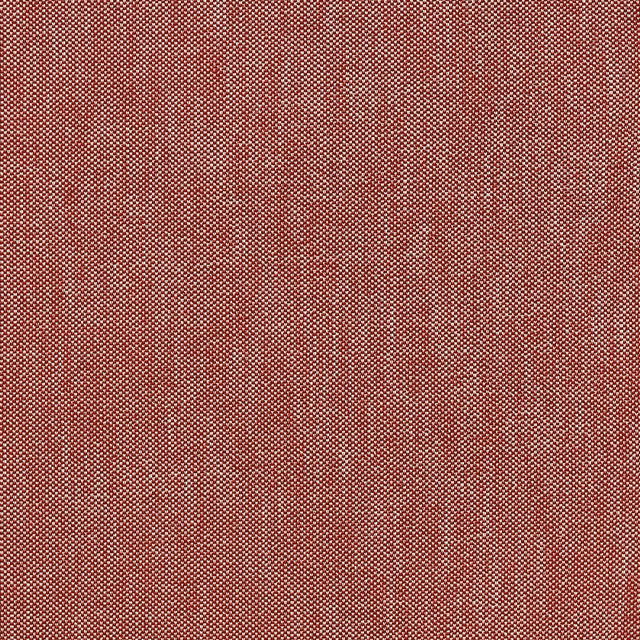 Close-up of a muted red woven fabric with fine peppered texture