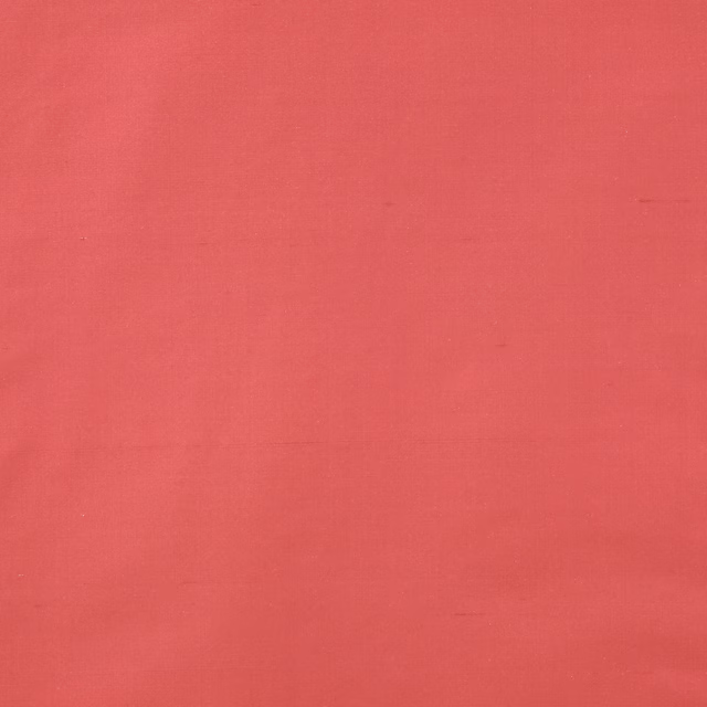Bright fuchsia silk fabric with a smooth, lustrous plain weave