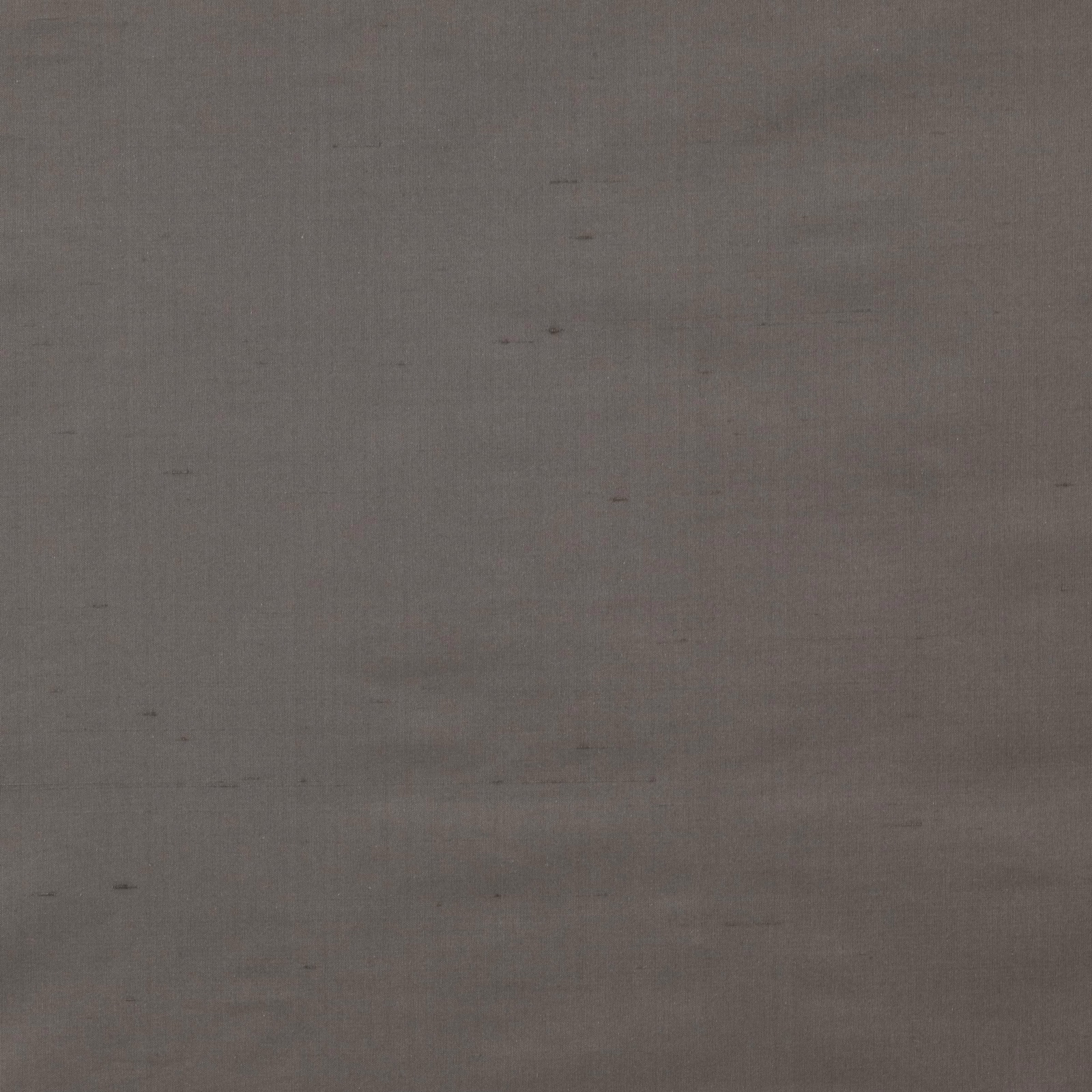 Close-up of soft graphite grey silk with subtle slubs and a smooth plain weave