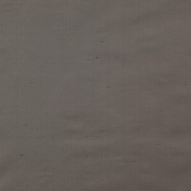 Close-up of soft graphite grey silk with subtle slubs and a smooth plain weave