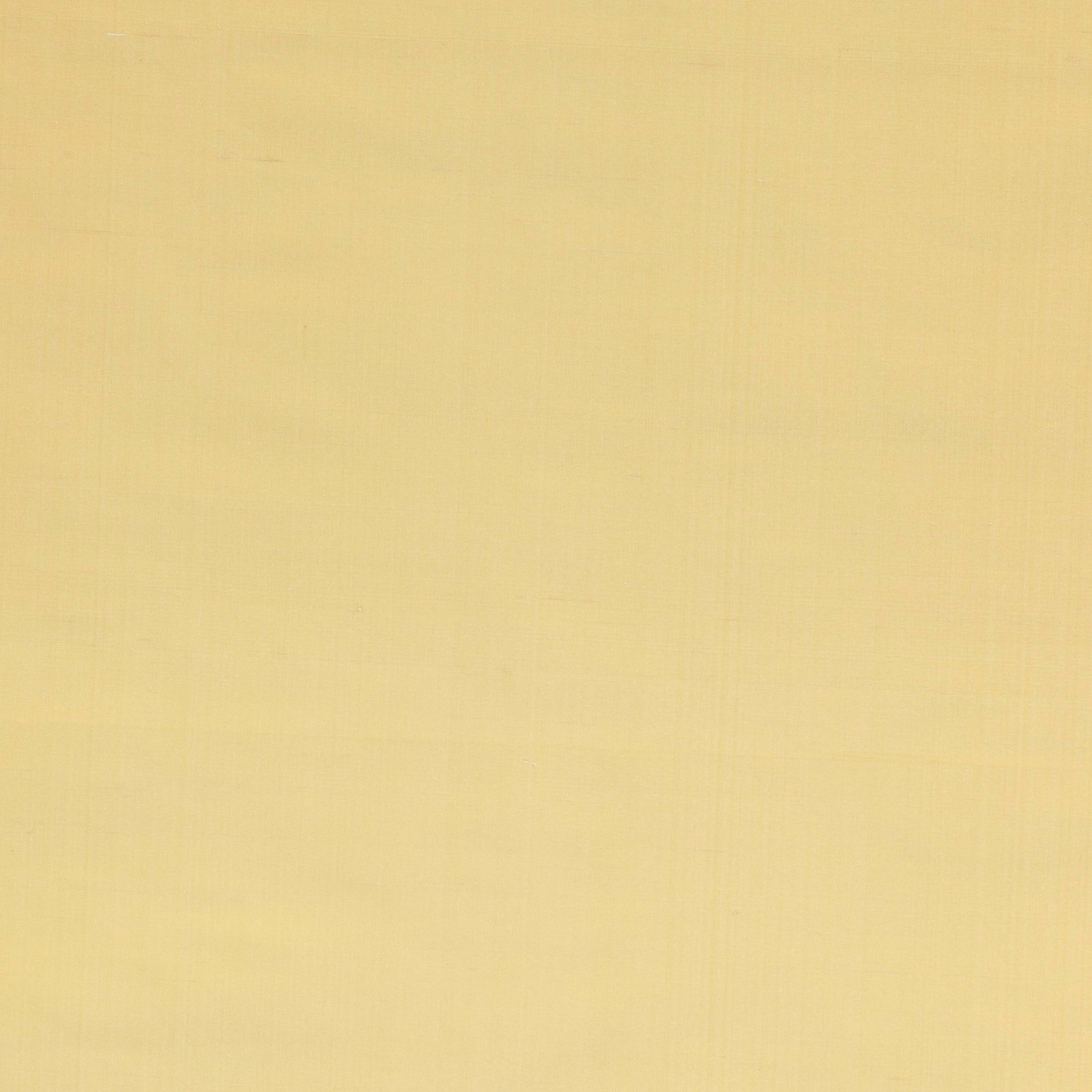Plain soft ochre silk fabric with a smooth, luminous surface