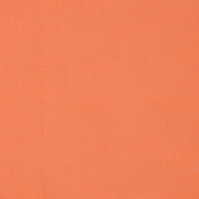 Close-up of finely woven mandarine orange fabric with a smooth plain texture