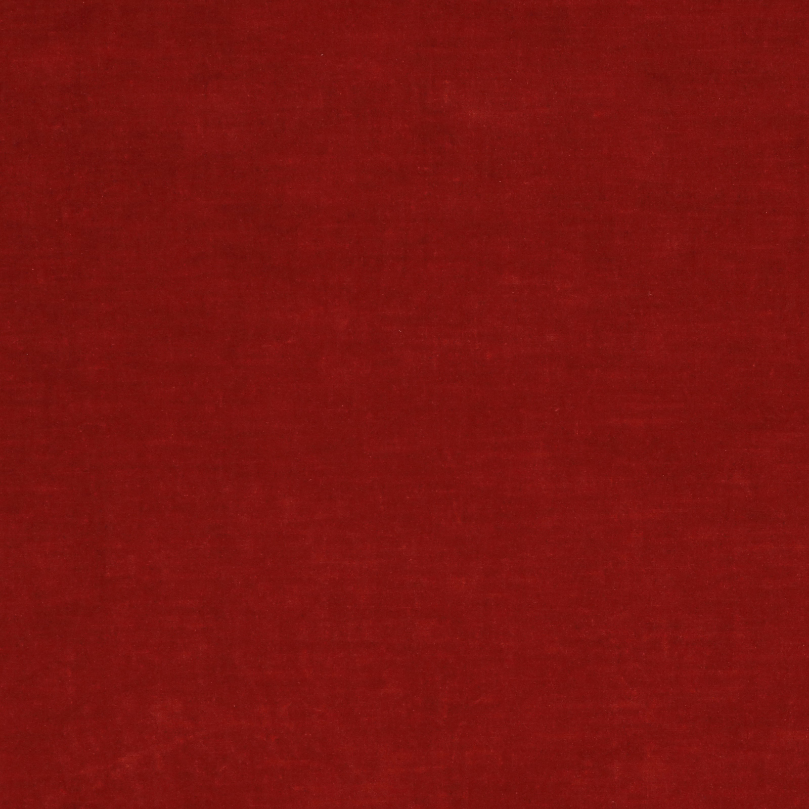 Plain burnt orange fabric swatch with a softly textured weave and deep red undertones