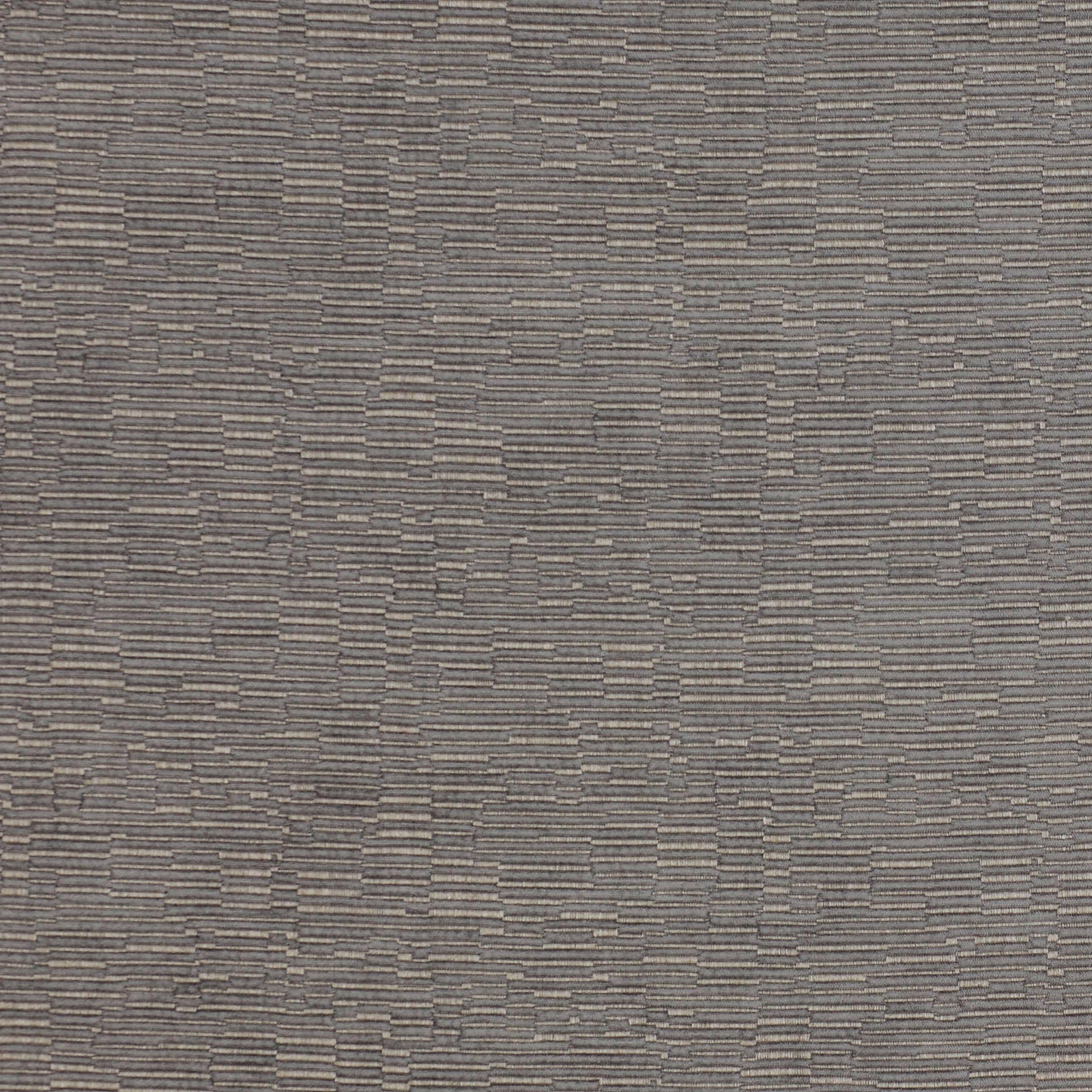 Close-up of grey woven fabric with small stepped geometric texture