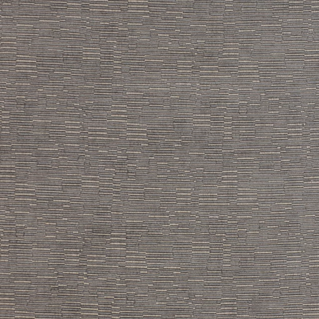 Close-up of grey woven fabric with small stepped geometric texture