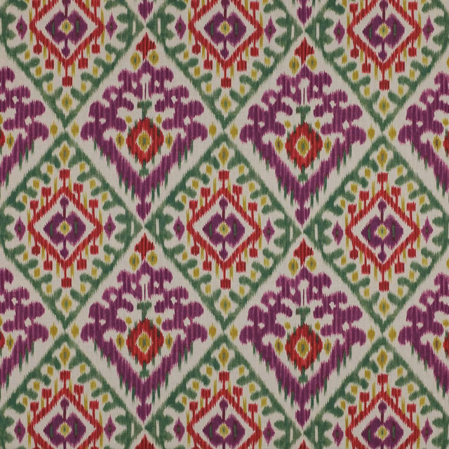 Colourful ikat-style geometric linen swatch in violet, green, red and yellow on a pale ground