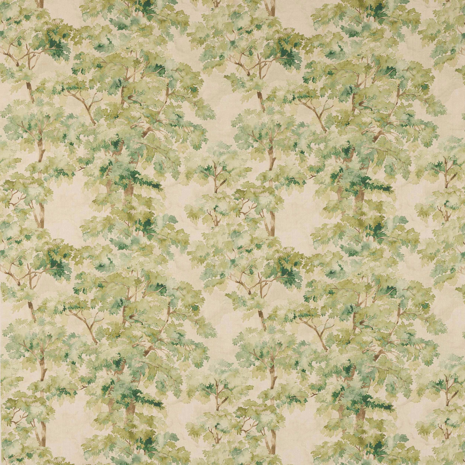 Painterly tree motif fabric with soft green foliage on a cream ground