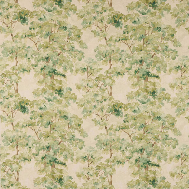 Painterly tree motif fabric with soft green foliage on a cream ground