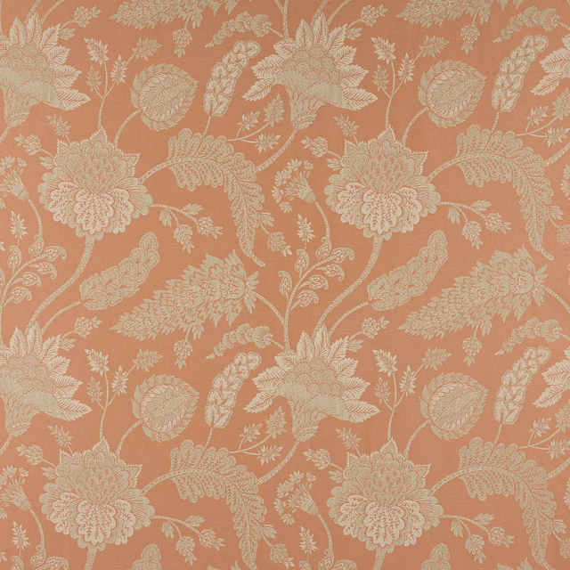 Cream floral and leaf motif on a warm russet terracotta woven fabric