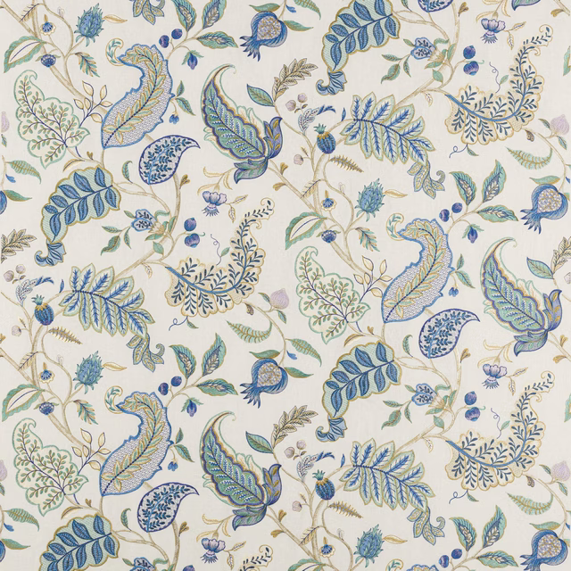 Ivory fabric swatch with scrolling blue and green floral vine embroidery