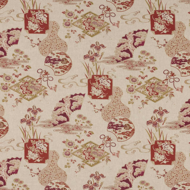 Printed linen fabric with terracotta-red, plum and gold scattered motifs on ivory ground