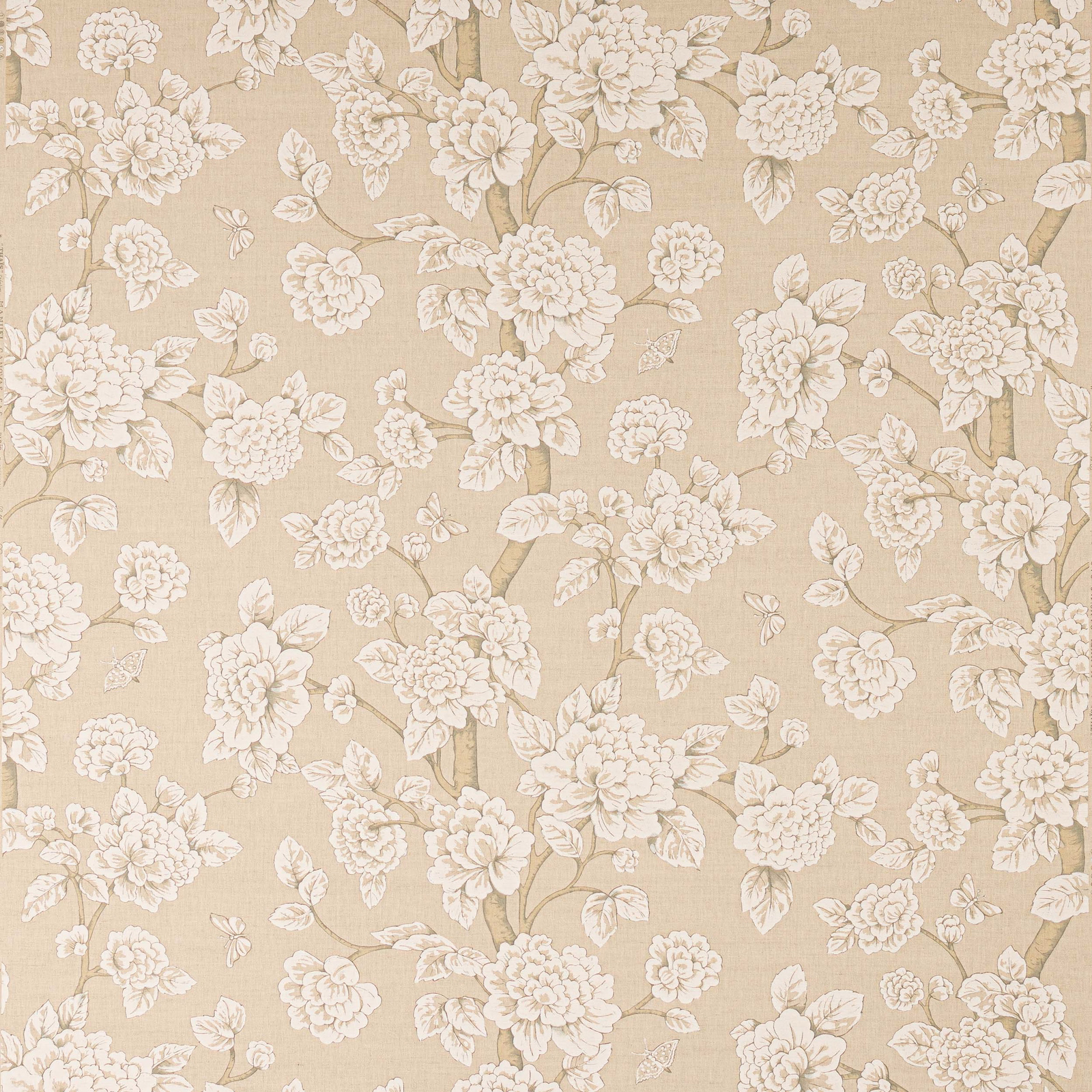 Soft ivory floral linen fabric with trailing blossoms on a warm beige ground