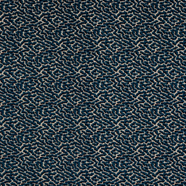 Close-up of small-scale teal-blue patterned fabric with beige outlines