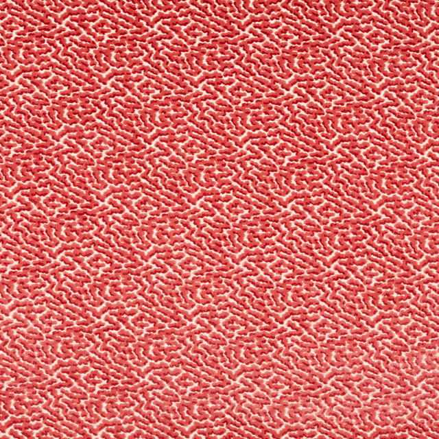 Coral pink textured abstract fabric with small irregular woven pattern