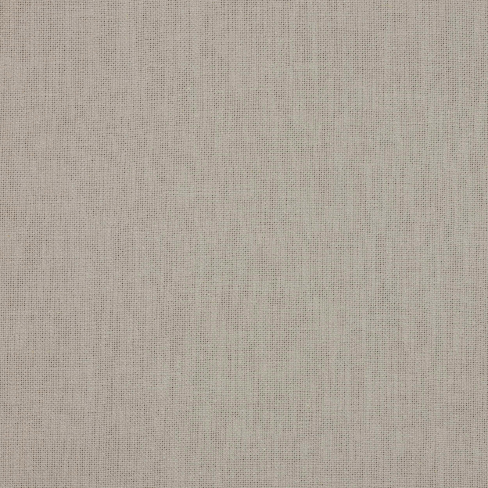 Close-up of soft warm ivory plain-woven linen fabric with fine texture