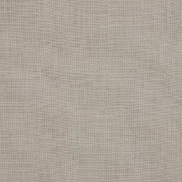 Close-up of soft warm ivory plain-woven linen fabric with fine texture
