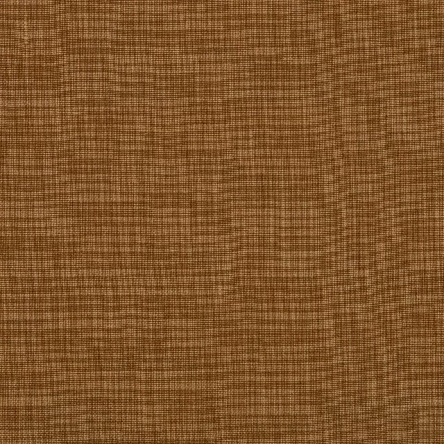 Close-up of warm ochre brown linen with a fine plain weave texture