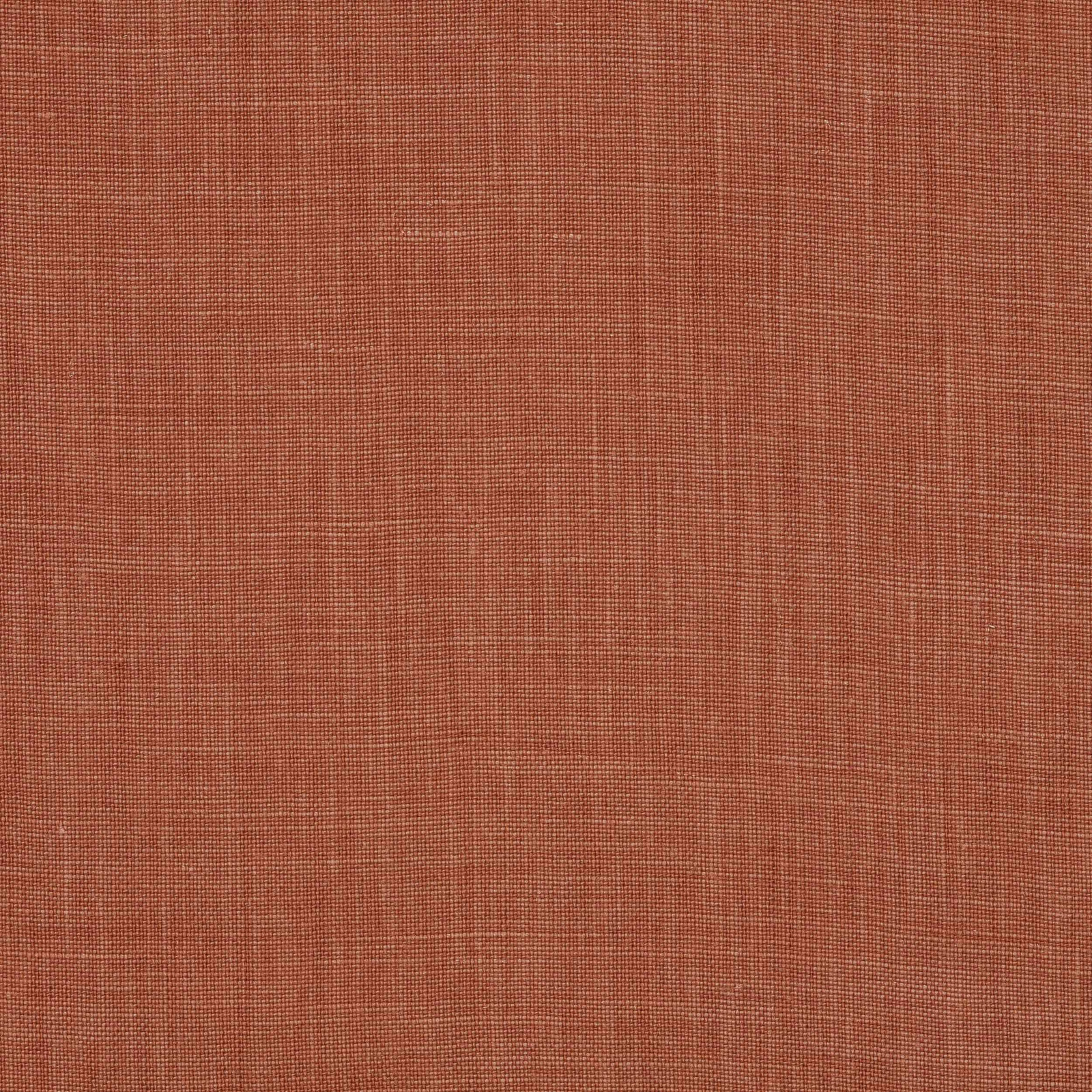 Close-up of warm terracotta plain-woven linen with fine natural slub