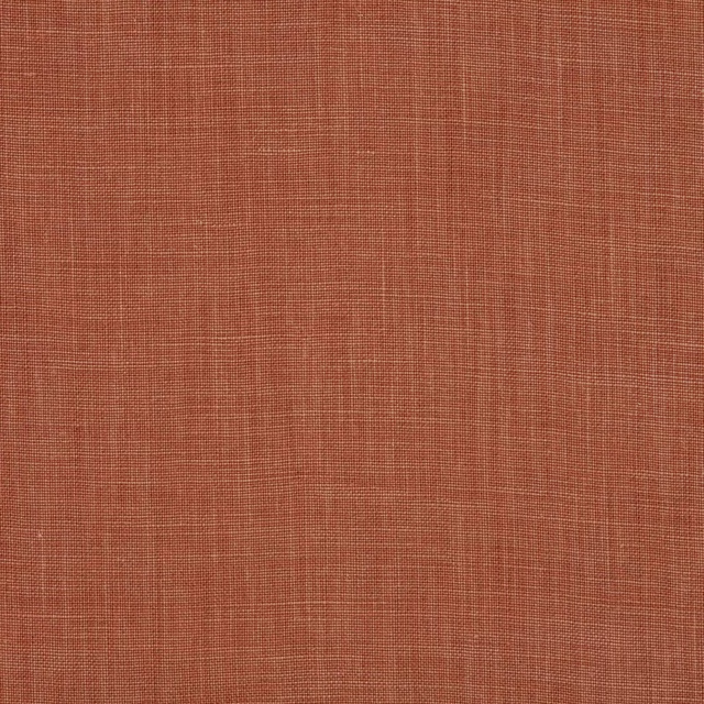 Close-up of warm terracotta plain-woven linen with fine natural slub
