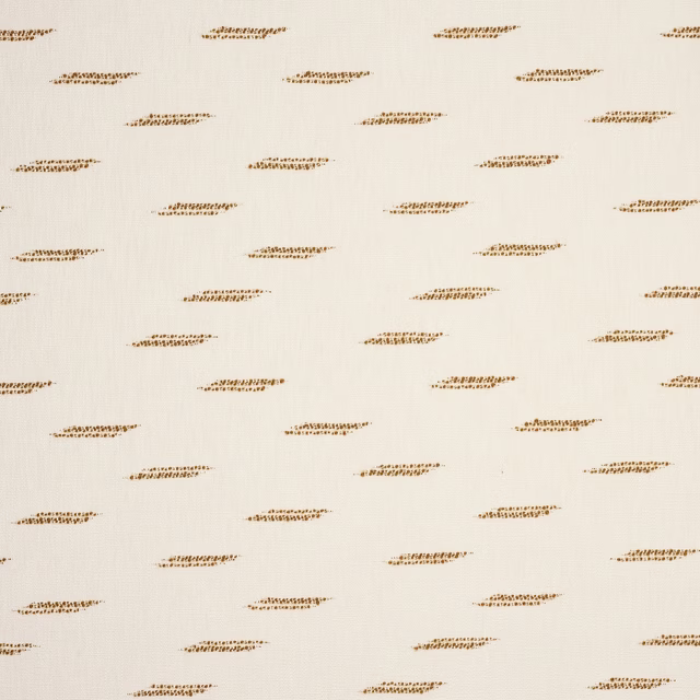Cream fabric swatch with small scattered warm gold dash motifs