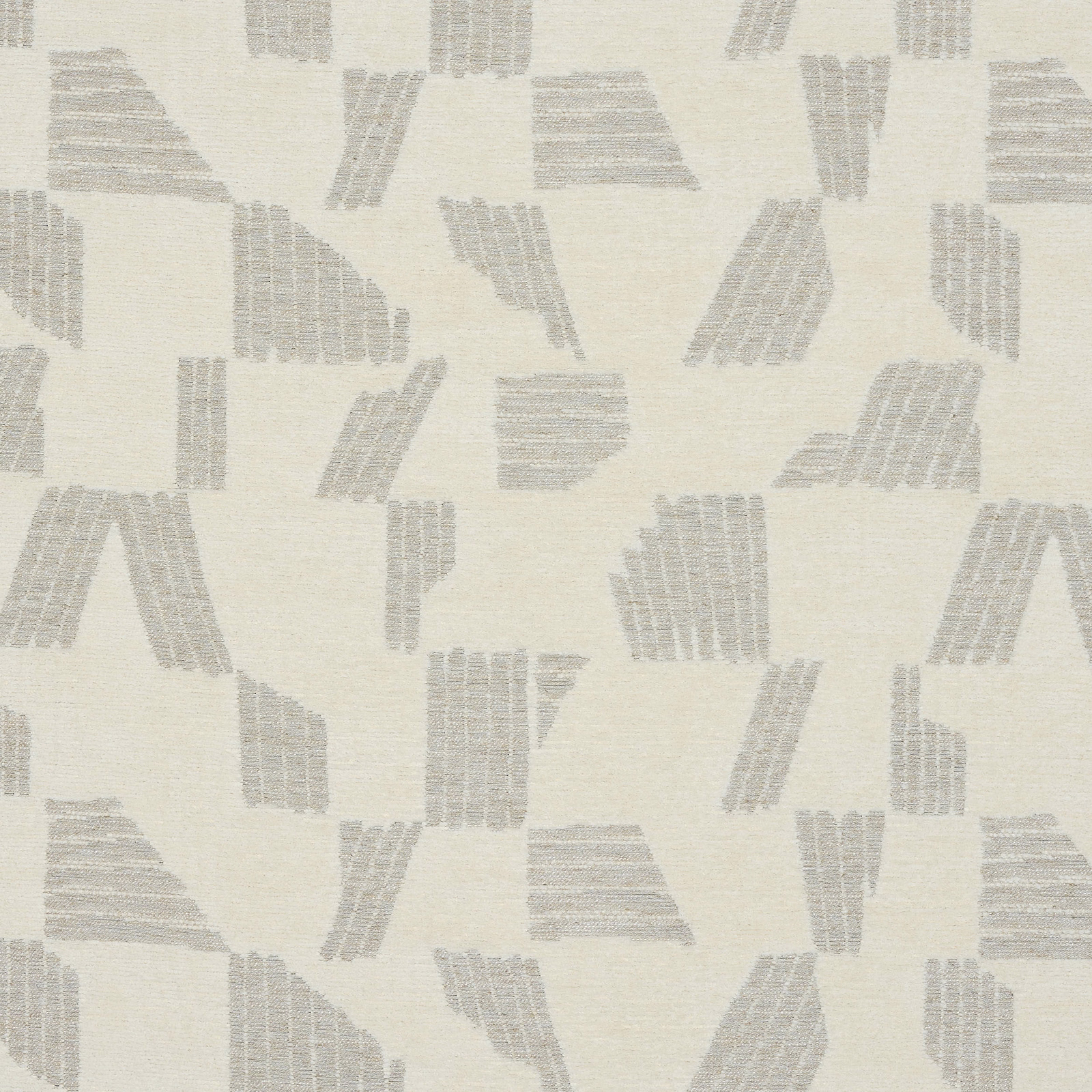 Ivory fabric swatch with pale grey abstract geometric blocks and fine woven texture