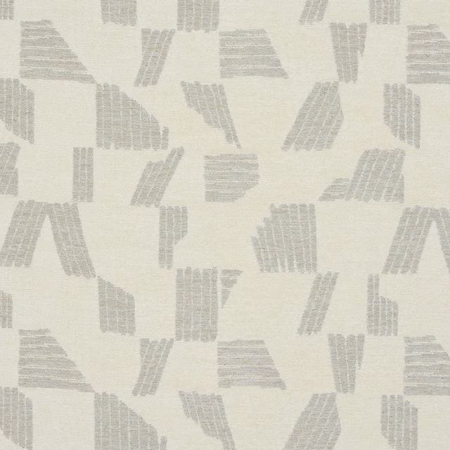 Ivory fabric swatch with pale grey abstract geometric blocks and fine woven texture