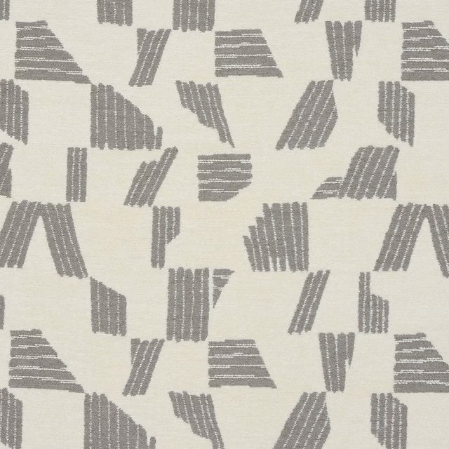 Steel-grey geometric woven motifs on a pale ivory fabric swatch