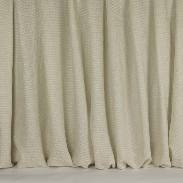 Pale clay-beige linen fabric with subtle small woven texture and soft drape folds