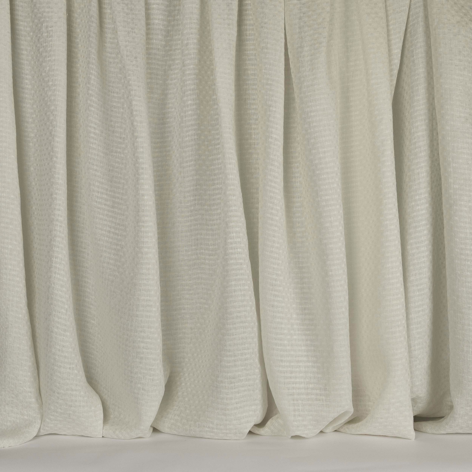 Soft fog white woven curtains with a subtle linen texture and gentle vertical folds